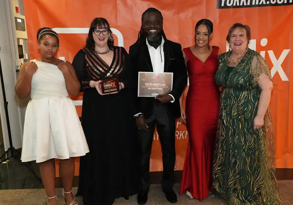 The Hearing Place Team collecting the Gold Award from the York Mix Awards for Best Household Service 2024
