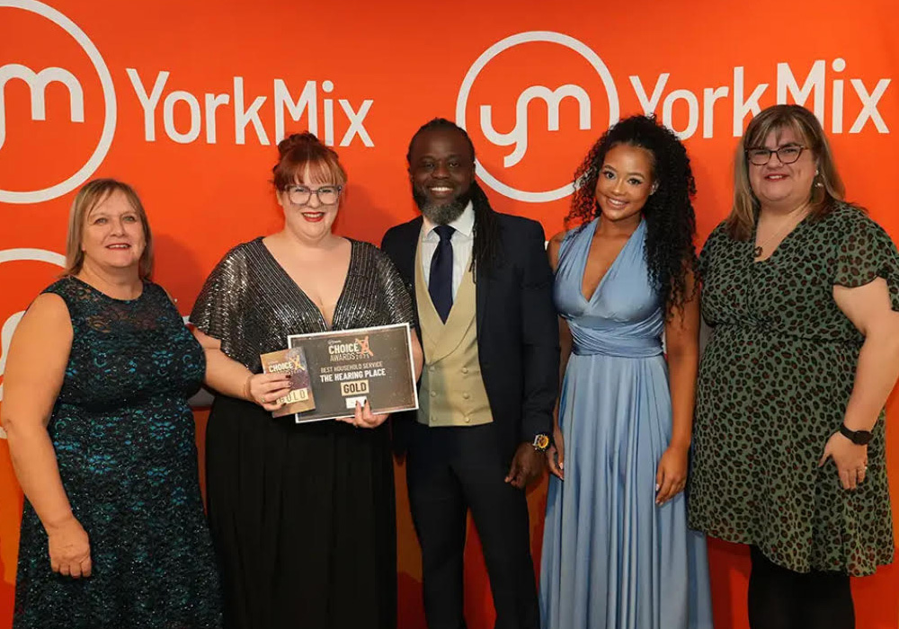 The Hearing Place Team collecting the Gold Award from the York Mix Awards for Best Household Service