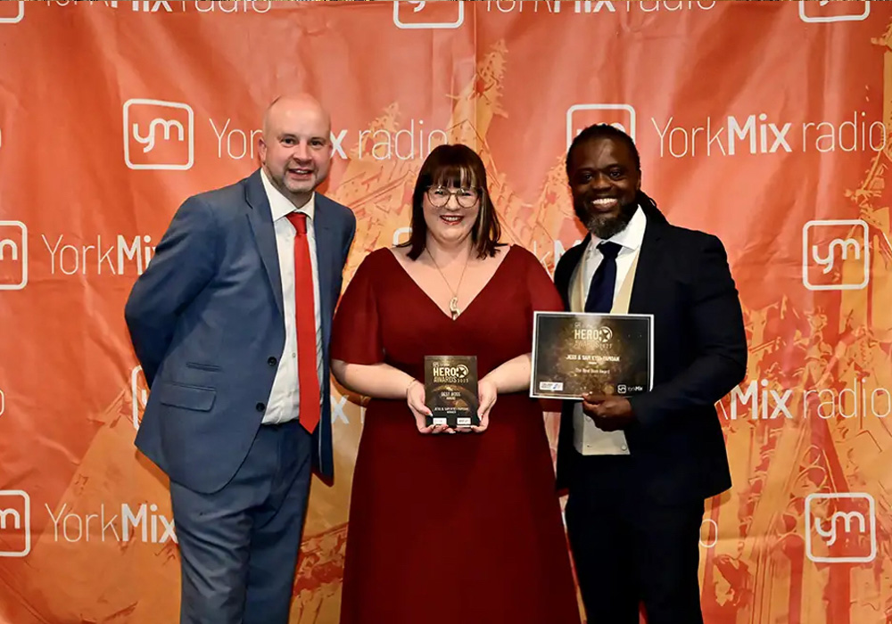 the Hearing Place team collecting the award for 2020 best boss at the York Mix Awards