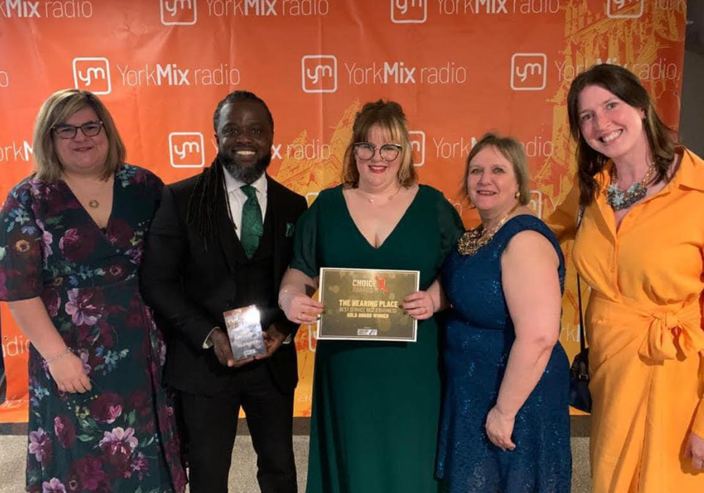 The Hearing Place team collecting the award for 2023 Best Service at the York Mix Awards